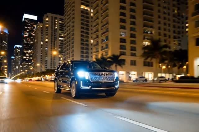 Black Cadillac Escalade at night
